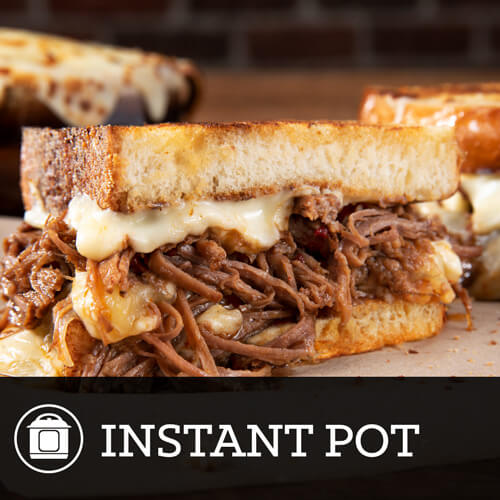Instant pot cooked shredded beef on toasted bread 