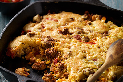 Easy Mexican-Style Beef Sausage Cornbread Skillet recipe provided by the Certified Angus Beef® brand.