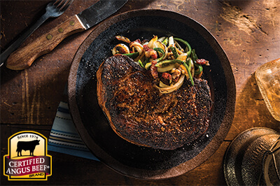 Cast Iron Charred Ribeye with Bacon, Whiskey Onions and Hot Peppers recipe provided by the Certified Angus Beef® brand.