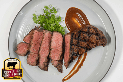 Evander’s Grilled Strip Steaks with Real Deal Steak Sauce recipe provided by the Certified Angus Beef® brand.