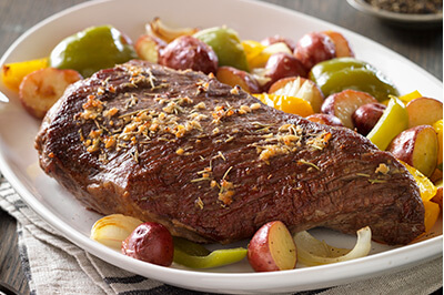 Tri-Tip Roast with Rosemary-Garlic Vegetables recipe provided by the Certified Angus Beef® brand.