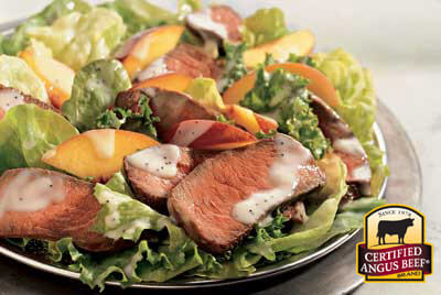 Sirloin Peach Salad recipe provided by the Certified Angus Beef® brand.