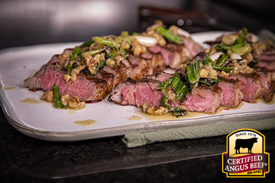 New York Strip Steaks with Charred Scallion Relish recipe provided by the Certified Angus Beef® brand.