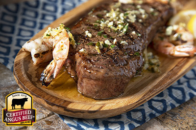 Strip Steaks with Shrimp and Scampi Butter recipe provided by the Certified Angus Beef® brand.