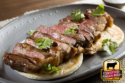 Strip Steaks and Arepas recipe provided by the Certified Angus Beef® brand.